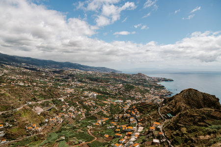 Aerial view of the Atlantic ocean and village Camara de Lobos, on Madeira island, Portugalの写真素材