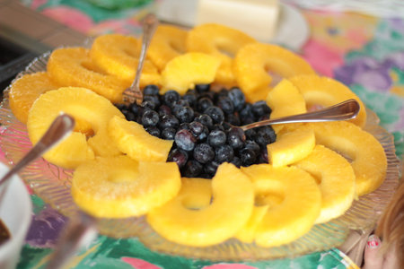 pineapple rings and blueberry as dessert at partyの写真素材