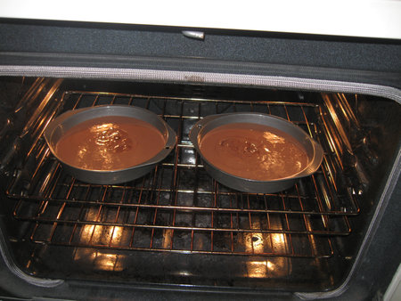 2 layer chocolate cake in ovenの写真素材