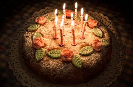 Birthday cake with handmade decorations and candlesの写真素材