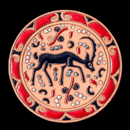 Ceramic dish with colorful decorations on black backgroundの写真素材