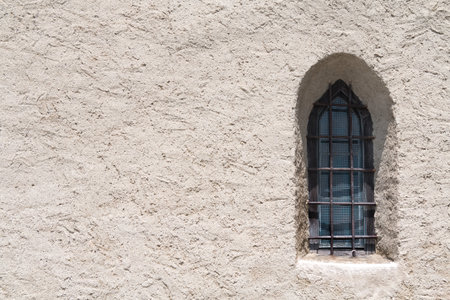 Gothic window in a mountain church space for writingの写真素材