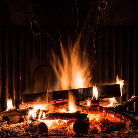 Fireplace with blazing flames, view of the fireの写真素材