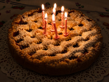 Birthday cake with handmade decorations and candlesの写真素材