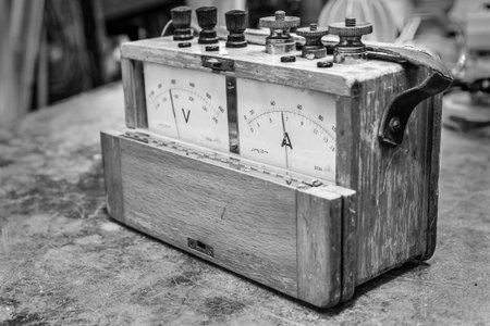 Vintage analog electric meter on the old wooden table testの写真素材