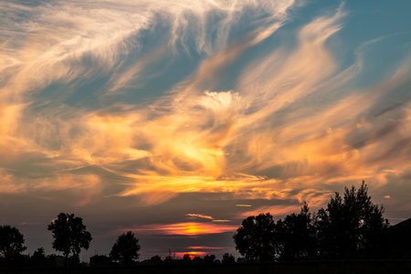 Spectacular sunset and coloured clouds captured in the Po Valley (Italy)の写真素材