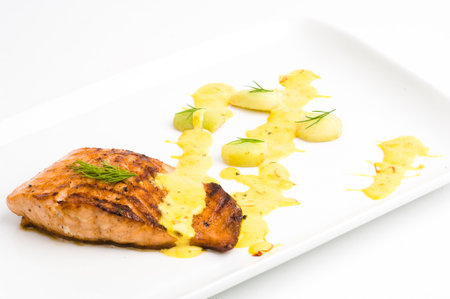 Roasted salmon with a lemon butter sauceの写真素材