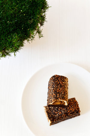 Tasty biscuit covered with chocolate and nuts