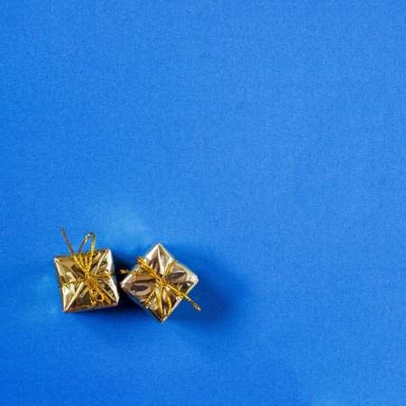 Christmas gift boxes on a blue backgroundの写真素材