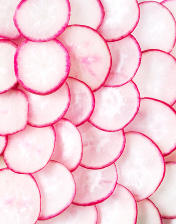 Natural background with fresh radishes slicesの写真素材