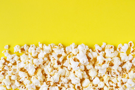 Popcorn on a yellow backgroundの写真素材