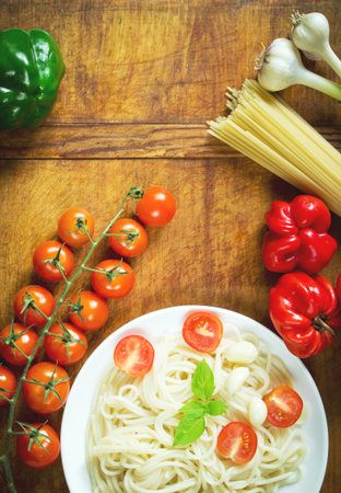 Pasta with tomatoes, pepper and basil, ready-to-eatの写真素材