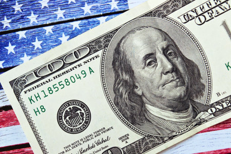 Hundred dollars on United states flag background, closeupの写真素材