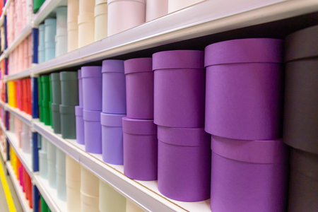 Background from multicolor round gift boxes on shelves in a flowershop
