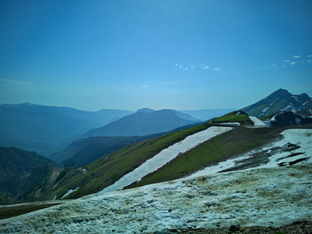 Mountain landscape with snow and clear blue sky.の写真素材