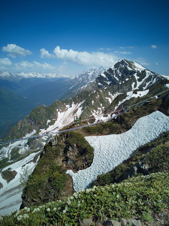 Mountain landscape with snow and clear blue sky.の写真素材