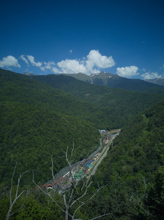 Landscape view of mountain and valley with blue sky and clouds.の写真素材