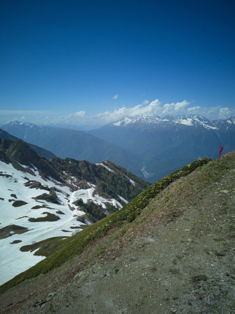 Mountain landscape with snow and clear blue skyの写真素材