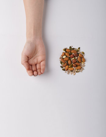 Hand with nutsの写真素材