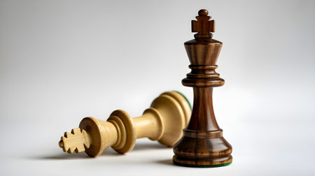 Close-up of chess kings symbolizing victory and defeat, representing leadership, strategy, power, and success in business or competition.の素材