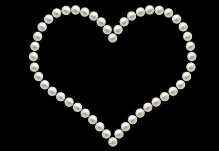 Nice image with shining white pearls like a heartの写真素材
