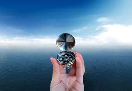 A Seaman who want to find the way with a compassの写真素材