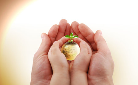 Here you can see hands and a small earthの写真素材