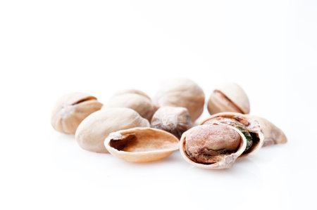Detail of pistachios isolated on white backgroundの写真素材