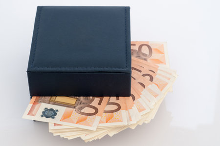 Cardboard box with 50 euro notesの写真素材