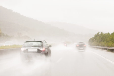 Cars on a road with stormの写真素材