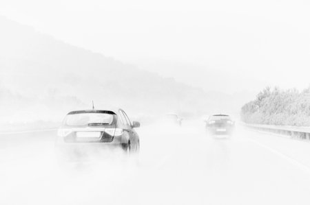 Cars on a road with stormの写真素材