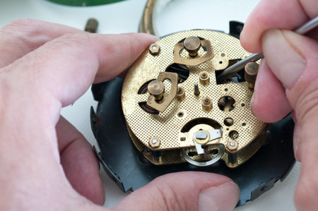 Clock disassembled for repair and calibrationの写真素材