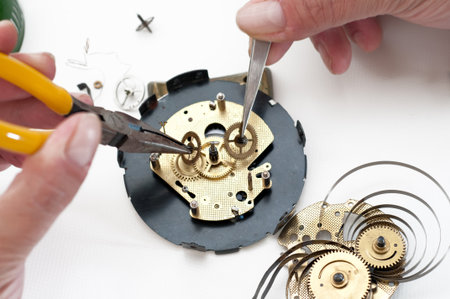 Clock disassembled for repair and calibrationの写真素材