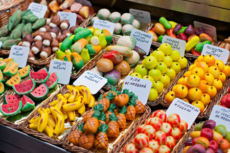 Assorted fruit-shaped marzipan in marketの写真素材