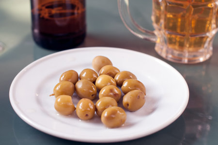 Plate with olives and beerの写真素材