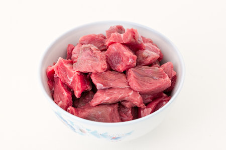 Closeup of a bowl of beef stew prepared to stewの写真素材