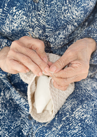 Detail of the hands of an elderly person crochetingの写真素材