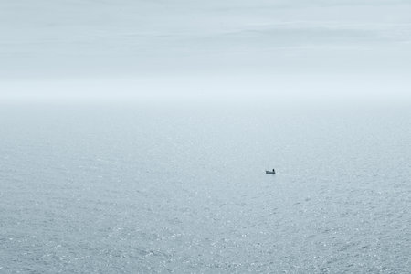 Panoramic view of a fisherman in his boatの写真素材