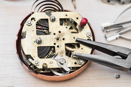 Old alarm clock for restorationの写真素材