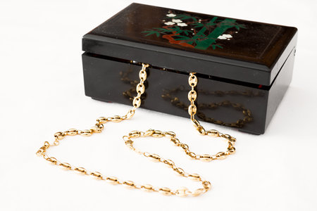 Detail of a jeweler with gold chain