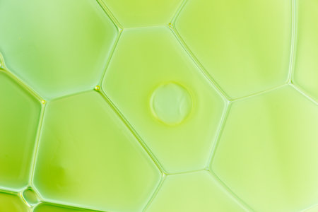 Detail of several colorful water drops in tension