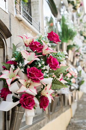 Barcelona, Spain - April 30, 2019. - Details of tombs and burial niches in formation of several...