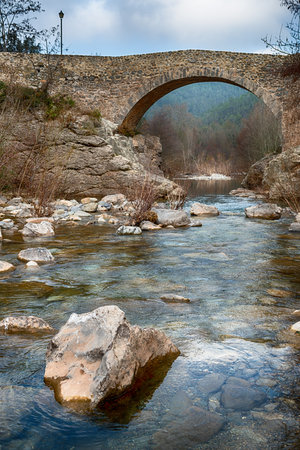 Details of the construction of a medieval bridge to cross a riverの写真素材