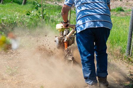 Detail of a monocultor preparing a field to be able to sow it