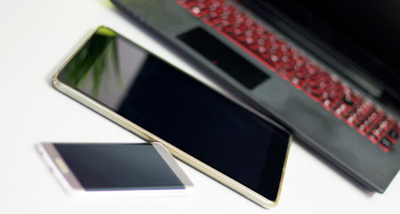 Laptop, tablet, smart phone - basic electronic devices for office work.