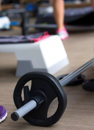 Barbell being part of a group fitness class.の写真素材