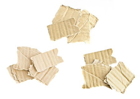 Broken pieces of cardboard boxes on a white background, macro photoの写真素材