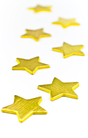 On a white background, gold stars all in a horizontal positionの写真素材