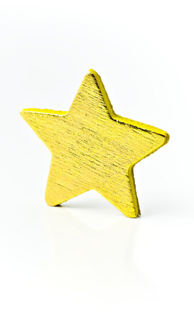 Isolated on white background a bright golden star.