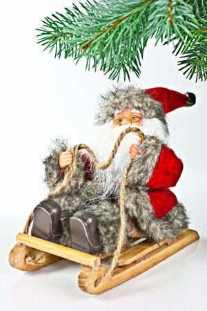 On white spruce twig, with Santa in the sleigh.の写真素材